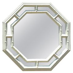 a mirror that is shaped like a octagon with an interlocked design