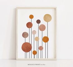 a framed art print with circles on it