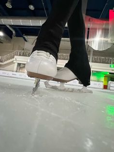 a person is skating on an ice rink