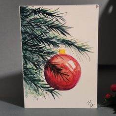 This red Christmas ball is perfect for your holiday wishes! These quality cards are individually hand painted and printed just for you. Each includes its own envelope.  Blank inside so you can use your own greeting. Made in the USA. Hand Painted Christmas Cards Acrylic, Loose Christmas Watercolor, Watercolor Ornament Card, Christmas Ornament Watercolor Paintings, Watercolor Christmas Cards Baubles, Christmas Watercolors, Hand Painted Christmas Cards, Watercolor Christmas Cards Diy, Felted Owl