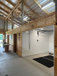 an empty garage with wooden walls and ceiling