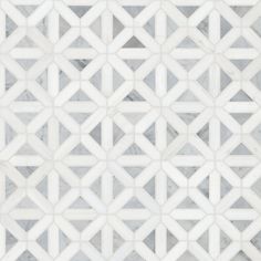 a white and grey marble mosaic tile with geometric design on it's sides, in an angled pattern