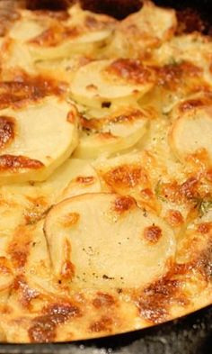 a close up of a pizza on a pan with cheese and onions in it,