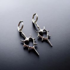 Unleash your bold style with the Spiked Heart Hughie Hoop Earrings - a perfect fusion of gothic edge and punk attitude. 🖤  These stainless steel earrings are designed for durability and long-lasting wear, making them as tough as they are stylish. 🔗  The edgy heart hoops are a standout piece that adds a rebellious touch to any outfit. 💀  Whether you're into alternative fashion or just love unique accessories, these earrings are the perfect choice for making a bold statement. ⚡  Treat yourself Earrings Edgy, Earrings Gothic, Edgy Earrings, Unique Accessories, Punk Jewelry, Gothic Punk, Steel Earrings, Bold Style, Wedding Jewelry Earrings