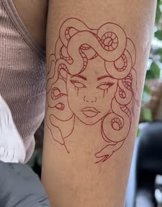 a woman's arm with a tattoo on it