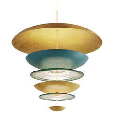 a light fixture hanging from the ceiling with three different colored glass bowls on it's sides