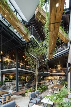 the interior of a restaurant with tables and chairs