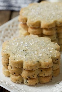 several cookies are stacked on a white plate