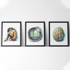 three framed pictures hanging on the wall next to each other with different types of artwork