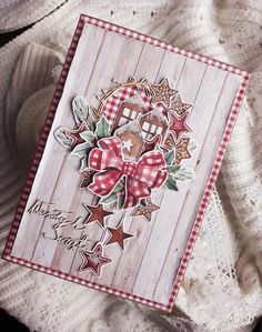 an old fashioned christmas card is laying on a lace doily