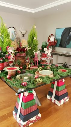 the table is covered with christmas decorations and presents