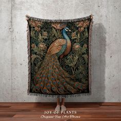 a peacock tapestry hanging on the wall