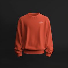 an orange sweatshirt on a black background with the word's logo in white letters