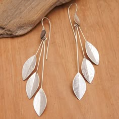 Growing from sterling silver branches, six handcrafted leaves in a hammered finish add a natural and sophisticated touch to these gorgeous dangle earrings. Balinese artisan Nyoman Nartawan creates this modern accessory, drawing inspiration from the stunning woods surrounding the region, which makes the design perfect for any occasion. Handmade Nature-inspired Metal Earrings, Nature-inspired Silver Metal Earrings, Handmade Leaf-shaped Metal Jewelry, Handmade Sterling Silver Nature-inspired Earrings, Handmade Metal Leaf-shaped Earrings, Hammered Metal Jewelry, Modern Silver Earrings, Contemporary Handmade Jewelry, Hardware Jewelry