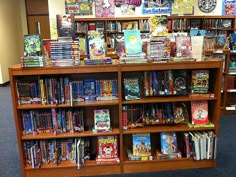 a book shelf filled with lots of children's books