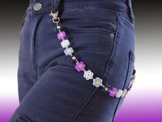 Set of decorative jeans chain of flowers made by Hama with a representative color of each Pride flag and a pair of earrings done with colored beads and combinable with the chain. All these articles are done by hand, resistant, suitable for Pride month, and very unique!  ⚠️ NOTICE: some colors may vary from the pictures. ✧･ﾟ:* This article can be sold separately 🌼 DIMENSIONS 🌼 Chain length: 51 cm (20,0787 inches) Flowers of the chain: 22 Earrings length: 4 cm - 4,3 cm (1,5748 inches - 1,69291 i Perler Bead Belt Chain, Chain Of Flowers, Earring Clay, Asexual Flag, Perler Designs, Pride Earrings, Jeans Chain, Pants Chain, Pant Chains