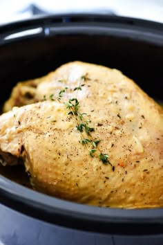 a close up of a chicken in a slow cooker