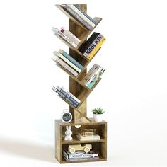 a bookshelf made out of wooden planks with various books on it and some plants