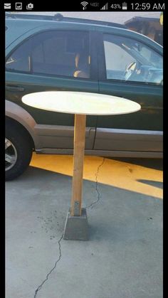 a small table sitting in front of a car