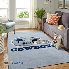 a living room with a couch, chair and rug that has the penn football team on it