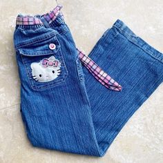 Sanrio Hello Kitty Size 6x Preowned Super Cute And Girly Hello Kitty Jeans Embroidered Patches On Back Pockets From Bottom Leg Upper Upper Front Pocket Coordinating Plaid Pink And Purple Check Belt Sparkly Large Hot Pink Crystals On All The Buttons A Little Wear Along The Back Bottom Heel Hem All Patches Are Stain Free And Look Brand New Hello Kitty Jeans, Silly Shirt, Kitty Clothes, Hello Kitty Clothes, 2000s Clothes, Jeans Embroidered, Hello Kitty Sanrio, Hello Kitty Cartoon, Pink Bling