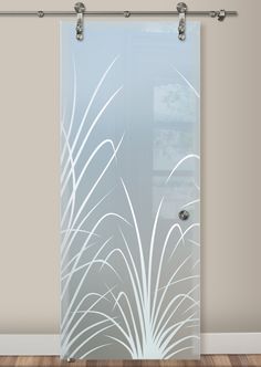 a glass door with an artistic design on it