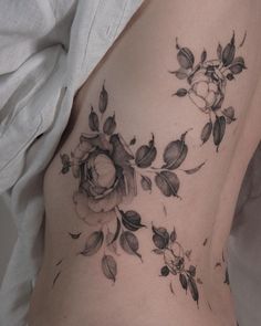 a woman's stomach with flowers on it