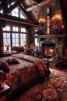 a bedroom with a bed, fireplace and large windows in the room that has many lights on