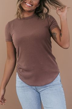 Our Basic Ribbed Tees are crafted from a stretchy ribbed fabric that is oh-so-comfortable. This piece features a full-length fit and a rounded hemline. An ideal basic meant for year-round wear. Neckline: Round Fabric: 65% Rayon, 30% Polyester, 5% Spandex Comfortable stretch Sizing (based on standard sizing): S (4/6) M (8/10) L (10/12) Designed with generous stretch fabrication and crafted to have a slimming true to size fit Model Specs: Emily is wearing a size small in the photo.How will this it Stretch Solid Color Tops For Layering, Basic Ribbed Stretch Tops, Ribbed Solid Stretch Tops, Basic Stretch Ribbed Tops, Stretch Solid Ribbed Top, Stretch Everyday Tops, Solid Stretch Ribbed Tops, Solid Ribbed Stretch Top, Stretch Solid Color Plain Tops