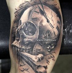 a man's leg with a clock and skull tattoo on it