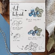 an art journal with blueberries and other things on the cover next to some scissors