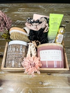 a wooden box filled with lots of different types of items on top of a table