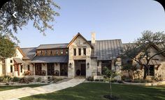 a large house with stone and wood accents