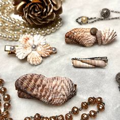 Welcome to our seaside-inspired collection of Shell Hair Clips! 🐚 Perfect for adding a touch of coastal charm to any hairstyle, these exquisite hair clips are a must-have accessory for Bridal Showers, Weddings, Beach-goers, and anyone seeking those quintessential summer vibes. Crafted with love and attention to detail, each hair clip varies in size and are made with natural shells. No two hair clips are alike, making each piece a unique treasure to be cherished. Please feel free to send me a me Sea Shell Hair Accessories, Wedding Hair Beach, Seashell Hair Accessories, Seashell Hair, Weddings Beach, Beachside Wedding, Wedding Barrettes, Hair Summer, Coastal Charm