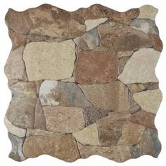 a stone wall that is made out of various types of rocks and has a white background