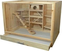 a wooden bird house with stairs inside