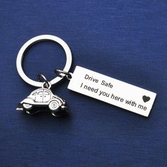 a keychain with a car on it that says drive safe i need you here with me