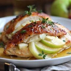 a white plate topped with chicken and apples