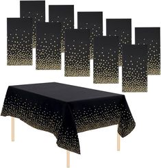 black table cloth with gold dots on it