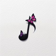 a music note with two butterflies on it's back and one in the middle