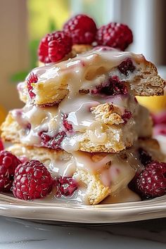 a stack of raspberry shortcakes sitting on top of a white plate