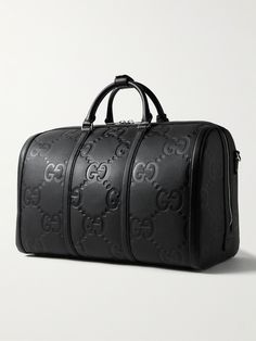 Gucci's duffle bag has been crafted in Italy from monogrammed full-grain leather and can be locked for peace of mind while travelling. It opens wide for easy access to your belongings and comes with a detachable shoulder strap. Get the matching briefcase to look polished on business trips. Gucci Bag Men, Duffle Bag For Men, Gucci Travel Bag, Gucci Collection, Drip Outfit Men, Look Polished, Bags Gucci, Gucci Monogram, Leather Duffle Bag