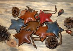 leather stars and pine cones on a wooden table