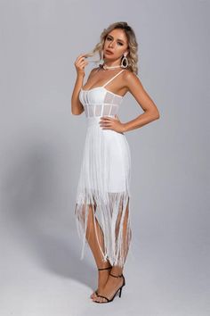 Going to a friend's party on the weekend and don't know what to wear? Then try our Ellie White Slip Tassel Party Dress! The pure white and luxurious exquisite design makes your temperament more noble and elegant, and can instantly dazzle in the crowd. The mesh at the waist is see-through, which can reveal a small waist. The flowing fringe on the skirt makes you walk like a fairy who has fallen into the mortal world. Pair it with a classic black leather pouch and a pair of stiletto heels for unde Silver Sequin Top, Don't Know What To Wear, Glitter Wedding Dress, Bandage Midi Dress, White Dress Party, Floral Shirt Dress, White Slip, Puff Sleeve Dresses, Maxi Knit Dress