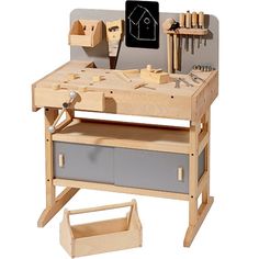 a child's workbench with tools on the table and in front of it