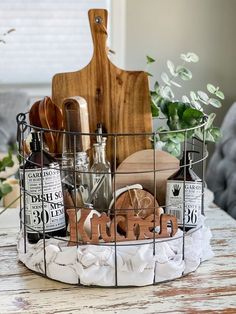 a basket filled with kitchen items sitting on top of a wooden table