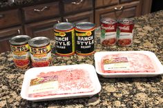 some canned food items are sitting on the counter