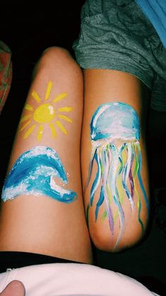 two people with their legs painted like jellyfishs