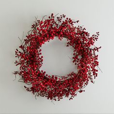 a red berry wreath on a white background