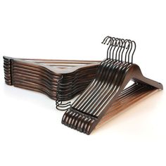 several wooden hangers stacked on top of each other